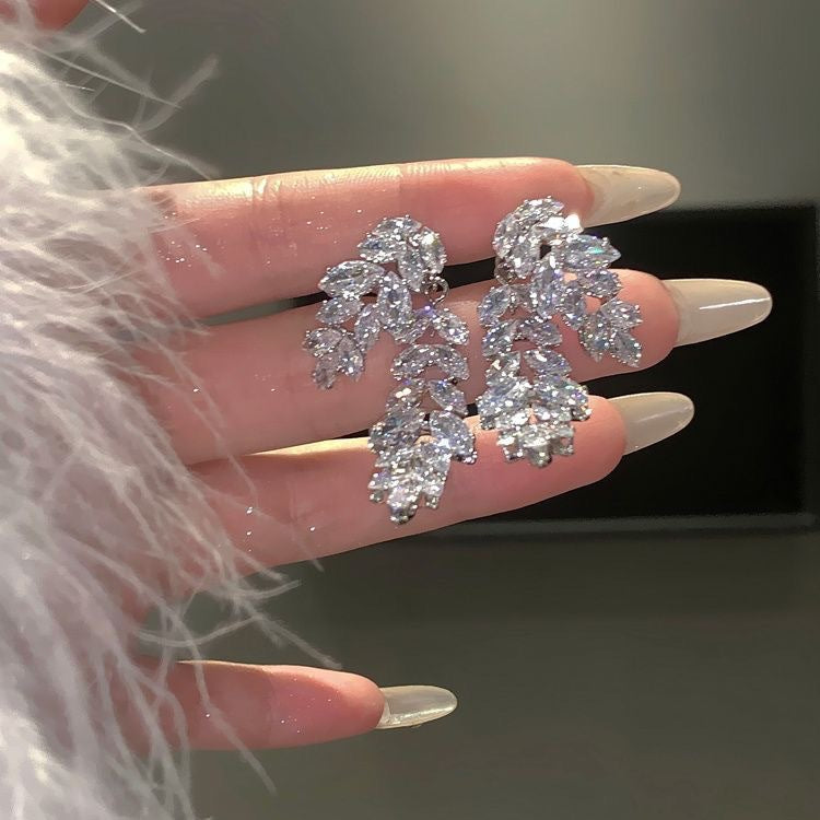 Fully Diamond-studded Leaf Earrings For A Sophisticated Lookwearable On Either Side